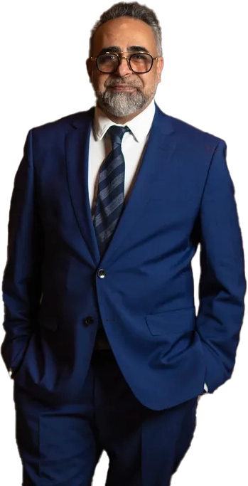 Dr. Kourosh Yousefzadeh in a navy suit at the Smile LA office