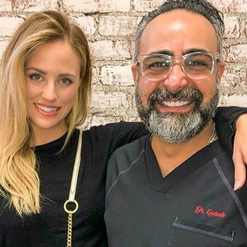A patient standing with Dr. Kourosh Yousefzadeh after treatment