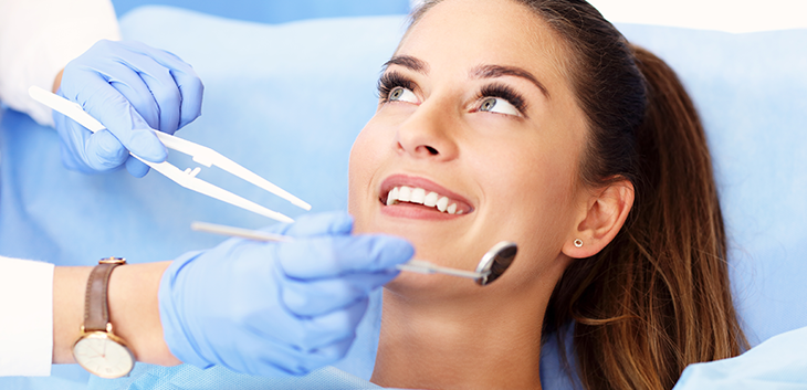 Woman smiling up at her dentist